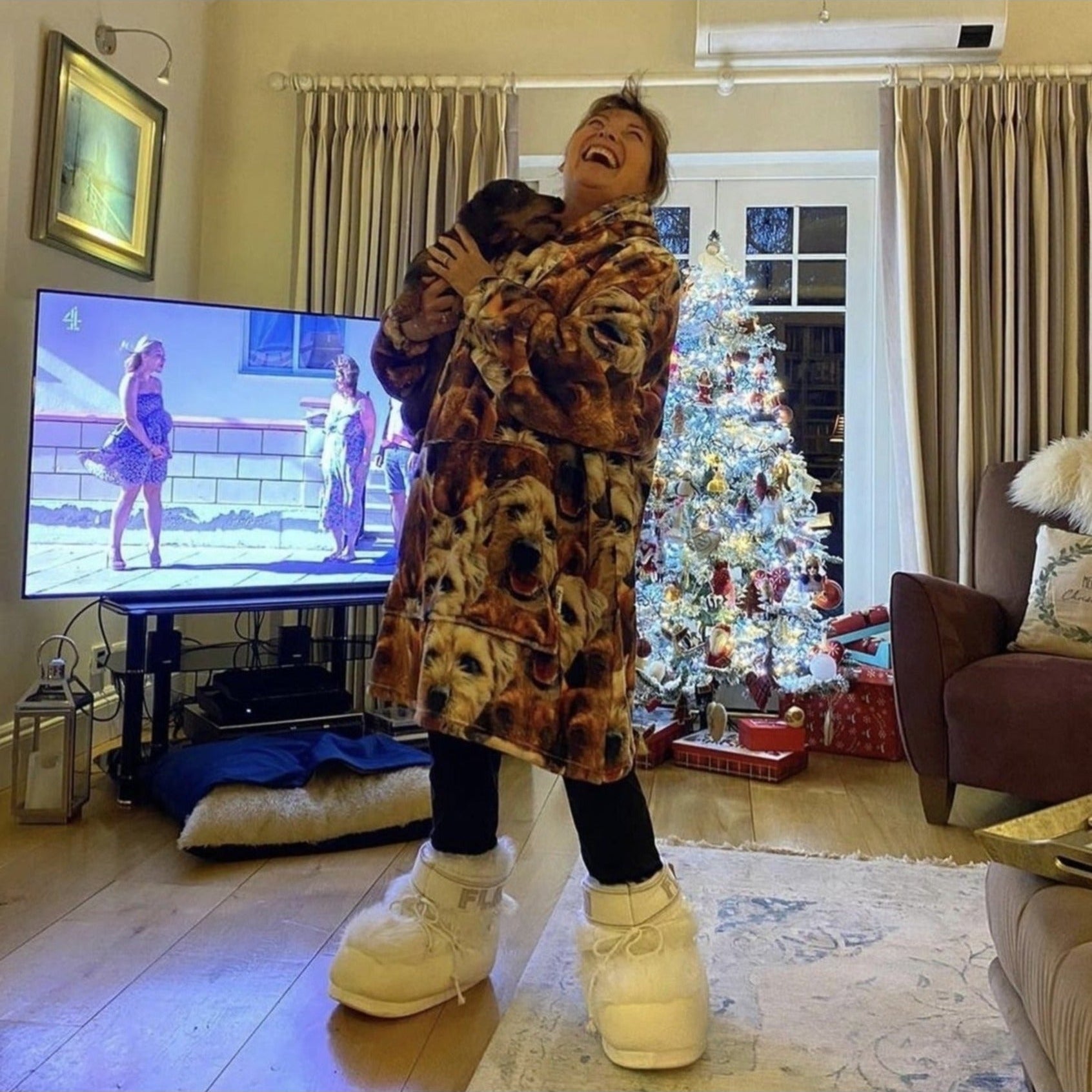 lorraine from itv laughing in hooded blanket